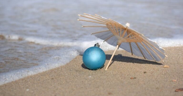 playa con sombrilla y reloj de arena